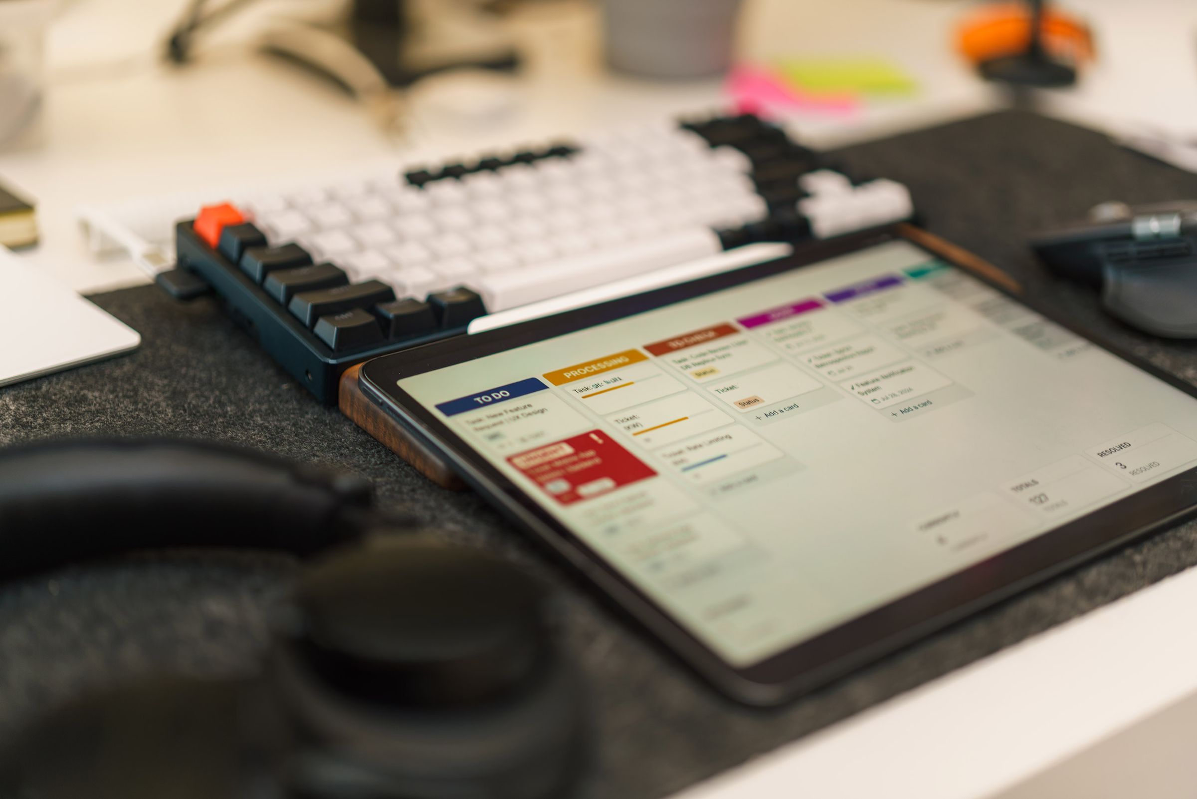 Product workspace with a tablet showing a UX design board